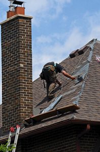 man working on a new roof